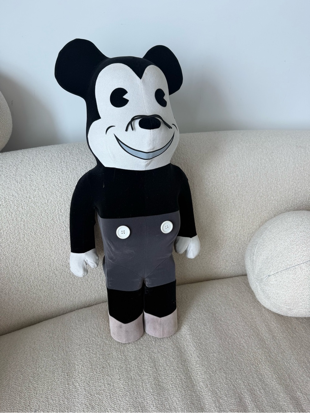 Monochrome Vintage-Style Plush Character in Black and White